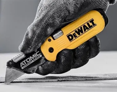 Dewalt Atomic Utility Knife in Worker Gloved Hand
